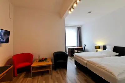 Ein Bett oder Betten in einem Zimmer der Unterkunft Hotel Jammerkrug