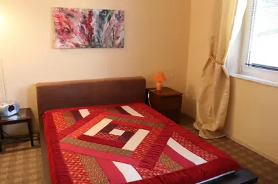 Ein Bett oder Betten in einem Zimmer der Unterkunft Apartment mit Gartenblick und kleines Apartment im 3 Familienhaus