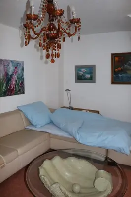 Ein Sitzbereich in der Unterkunft Apartment mit Gartenblick und kleines Apartment im 3 Familienhaus