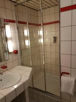 Ein Badezimmer in der Unterkunft Hotel am Stadtpark