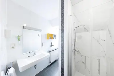 Ein Badezimmer in der Unterkunft Hotel Reichshof garni