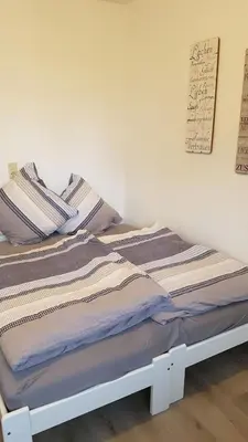 Ein Bett oder Betten in einem Zimmer der Unterkunft Ferienwohnung Veit