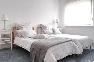 Ein Bett oder Betten in einem Zimmer der Unterkunft Ferienwohnung Speldorf