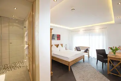 Ein Bett oder Betten in einem Zimmer der Unterkunft Hotel Restaurant Daute