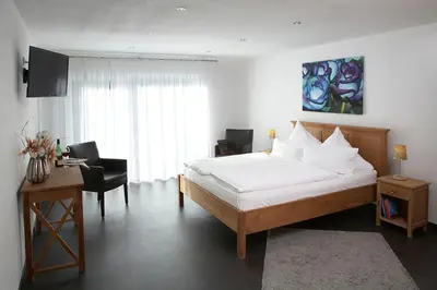 Ein Bett oder Betten in einem Zimmer der Unterkunft Hotel Restaurant Daute