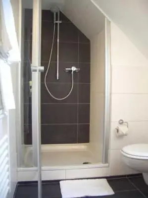 Ein Badezimmer in der Unterkunft Hotel Restaurant Daute