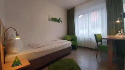 Ein Bett oder Betten in einem Zimmer der Unterkunft AKZENT Hotel Merfelder Hof