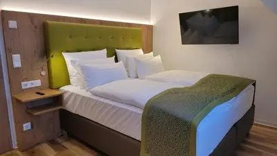 Ein Bett oder Betten in einem Zimmer der Unterkunft AKZENT Hotel Merfelder Hof