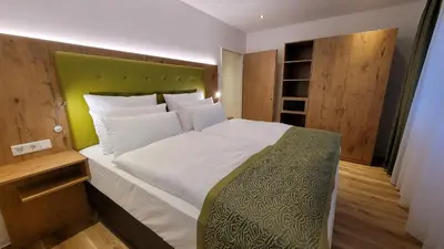 Ein Bett oder Betten in einem Zimmer der Unterkunft AKZENT Hotel Merfelder Hof