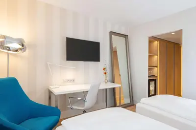 Ein Bett oder Betten in einem Zimmer der Unterkunft NH Essen