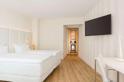 Ein Bett oder Betten in einem Zimmer der Unterkunft NH Essen