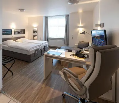 Ein Bett oder Betten in einem Zimmer der Unterkunft Hotel Böving