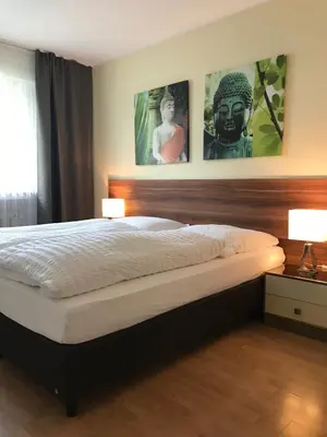 Ein Bett oder Betten in einem Zimmer der Unterkunft Apartmenthaus Sonnen