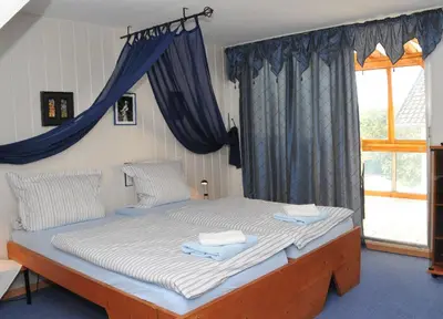 Ein Bett oder Betten in einem Zimmer der Unterkunft Pension Bella Vista