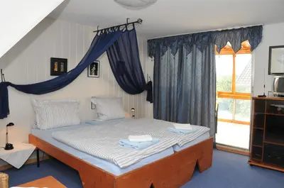 Ein Bett oder Betten in einem Zimmer der Unterkunft Pension Bella Vista