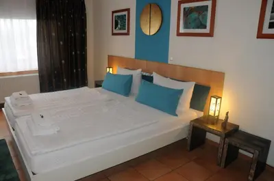 Ein Bett oder Betten in einem Zimmer der Unterkunft Pension Bella Vista