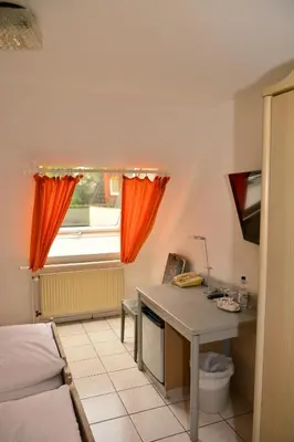 Ein Bett oder Betten in einem Zimmer der Unterkunft Hotel Wilhelmshöhe