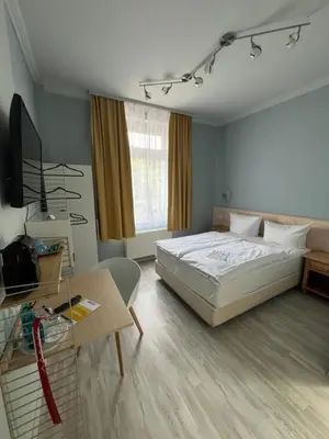 Ein Bett oder Betten in einem Zimmer der Unterkunft Fettehenne Gästehaus