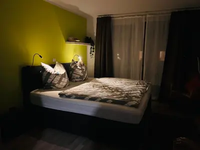 Ein Bett oder Betten in einem Zimmer der Unterkunft Pension Osthoff