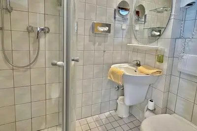 Ein Badezimmer in der Unterkunft Hotel Imperial