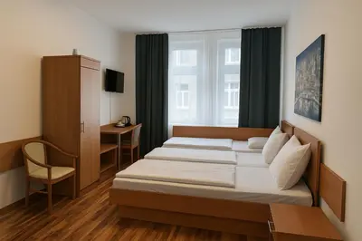 Ein Bett oder Betten in einem Zimmer der Unterkunft Centro Hotel Oberhausen