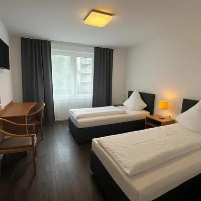 Ein Bett oder Betten in einem Zimmer der Unterkunft Centro Hotel Oberhausen