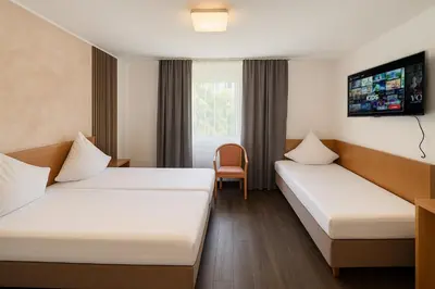 Ein Bett oder Betten in einem Zimmer der Unterkunft Centro Hotel Oberhausen