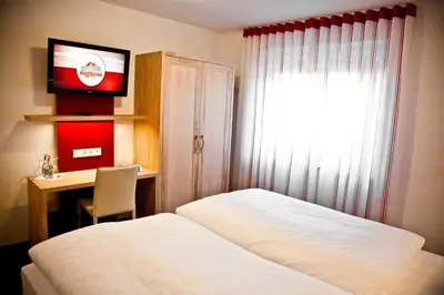 Ein Bett oder Betten in einem Zimmer der Unterkunft Hotel Brauhaus Stephanus