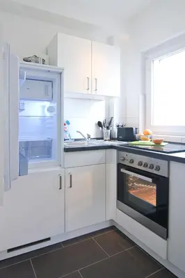 Küche/Küchenzeile in der Unterkunft apartmondo Monteurapartments