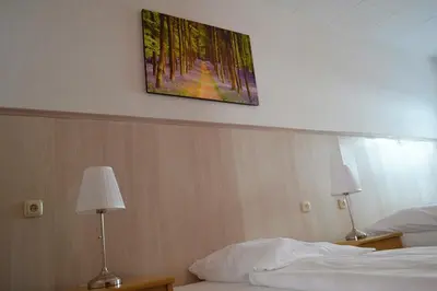 Ein Bett oder Betten in einem Zimmer der Unterkunft Hotel Hohenstein -Radweg-Messe-Baldeneysee