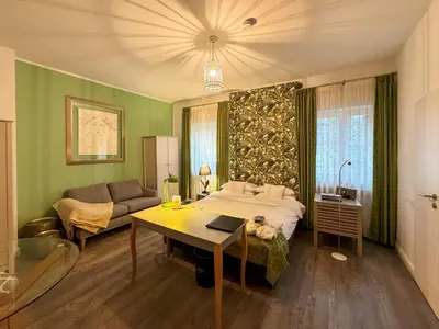 Ein Bett oder Betten in einem Zimmer der Unterkunft Trip Inn Boutique Rubens