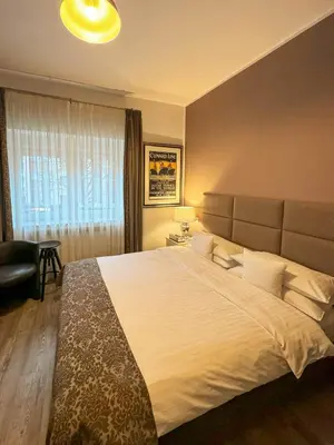 Ein Bett oder Betten in einem Zimmer der Unterkunft Trip Inn Boutique Rubens