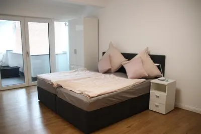 Ein Bett oder Betten in einem Zimmer der Unterkunft Am Kronengarten