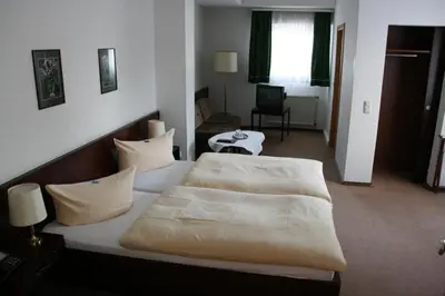 Ein Bett oder Betten in einem Zimmer der Unterkunft Hotel Diening