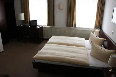 Ein Bett oder Betten in einem Zimmer der Unterkunft Hotel Diening