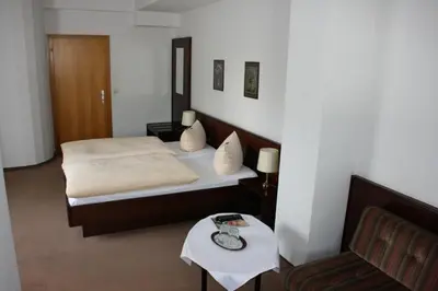 Ein Bett oder Betten in einem Zimmer der Unterkunft Hotel Diening