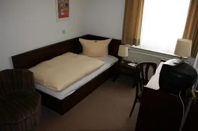 Ein Bett oder Betten in einem Zimmer der Unterkunft Hotel Diening