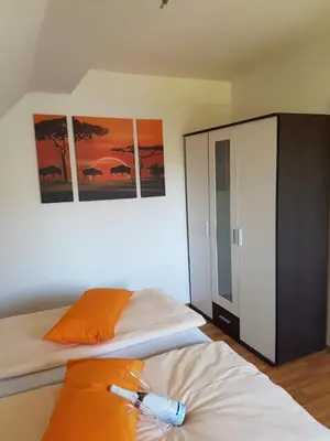 Ein Bett oder Betten in einem Zimmer der Unterkunft LORENZ Apartment 2