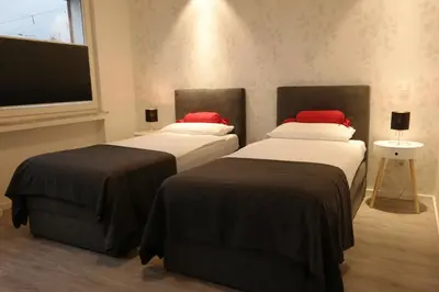 Ein Bett oder Betten in einem Zimmer der Unterkunft Minsu Hotel