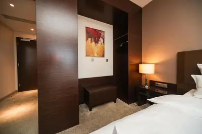 Ein Bett oder Betten in einem Zimmer der Unterkunft l'Arrivée Hotel & Spa