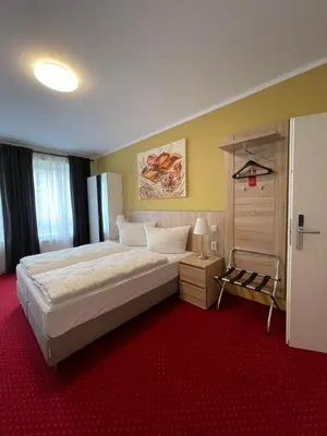 Ein Bett oder Betten in einem Zimmer der Unterkunft Palm Premium Hotel & Apartments