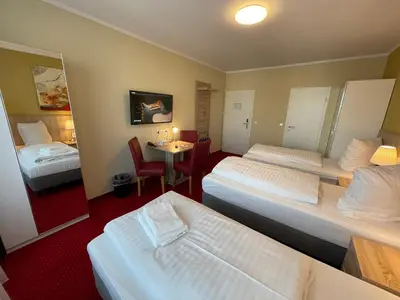 Ein Bett oder Betten in einem Zimmer der Unterkunft Palm Premium Hotel & Apartments