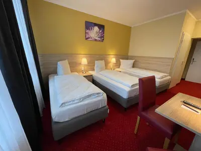 Ein Bett oder Betten in einem Zimmer der Unterkunft Palm Premium Hotel & Apartments