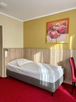 Ein Bett oder Betten in einem Zimmer der Unterkunft Palm Premium Hotel & Apartments