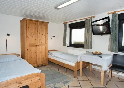 Ein Bett oder Betten in einem Zimmer der Unterkunft Pension Löw