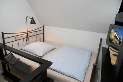 Ein Bett oder Betten in einem Zimmer der Unterkunft Pension Löw