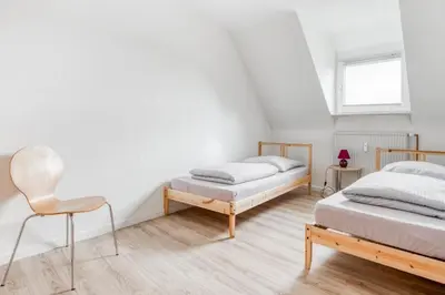 Ein Bett oder Betten in einem Zimmer der Unterkunft Gutmensch Oberhausen 4 Schlafzimmer