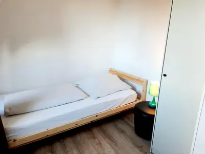 Ein Bett oder Betten in einem Zimmer der Unterkunft Gutmensch Oberhausen 4 Schlafzimmer
