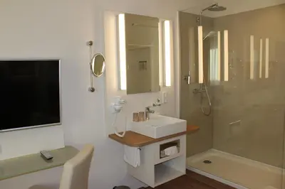 Ein Badezimmer in der Unterkunft Stüttgens Hotel