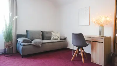 Ein Sitzbereich in der Unterkunft Hotel König